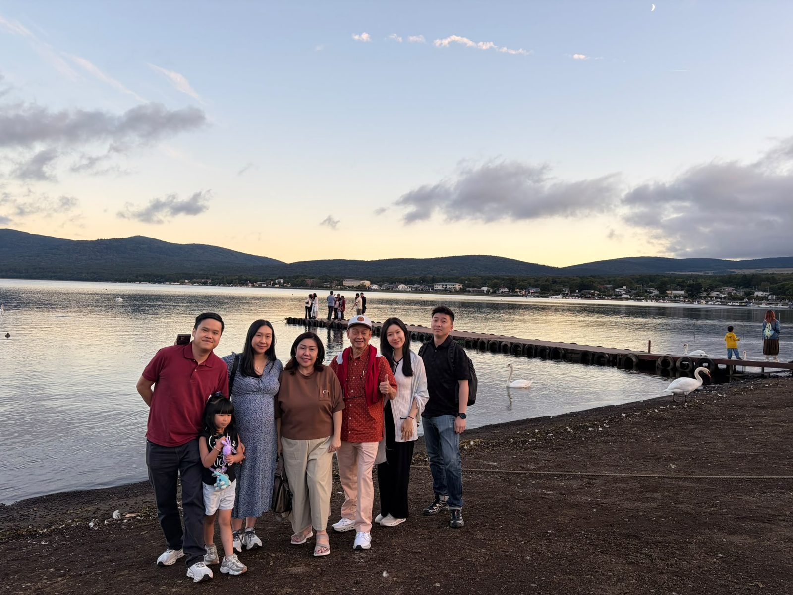 Family at a lakeside at dusk