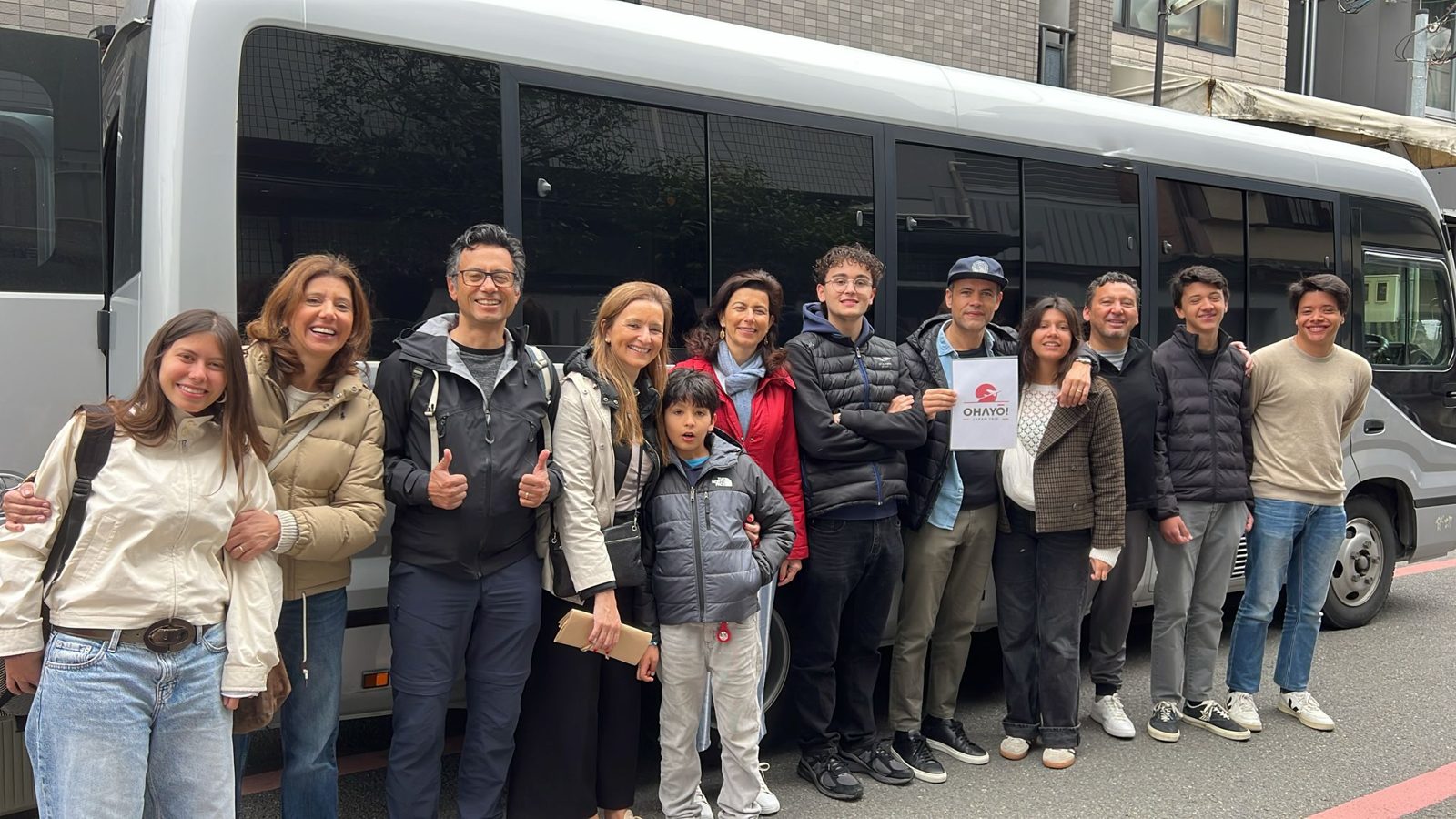 Mr. Rui and family from Spain beside the Ohayō tour bus